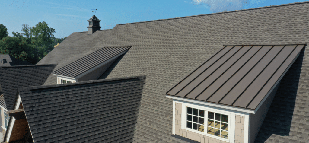 Modern house roof with shingles and windows.