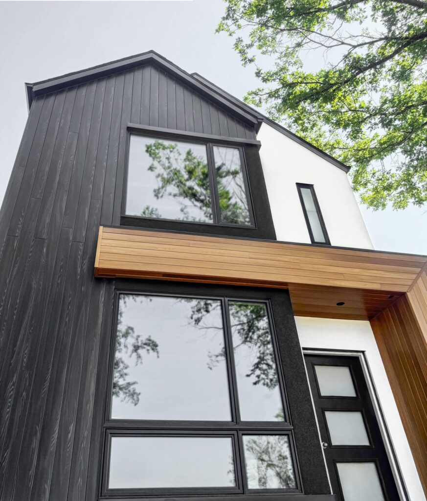Modern house with black and wood exterior panels